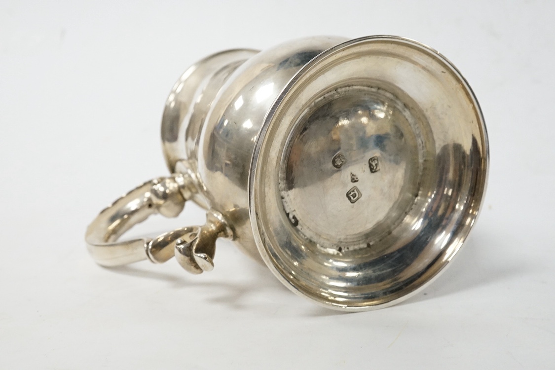 A late George II silver baluster pint mug, maker, ?B, London, 1759, with later engraved monogram(erasure), height 12cm, 13.8oz. Condition - poor to fair